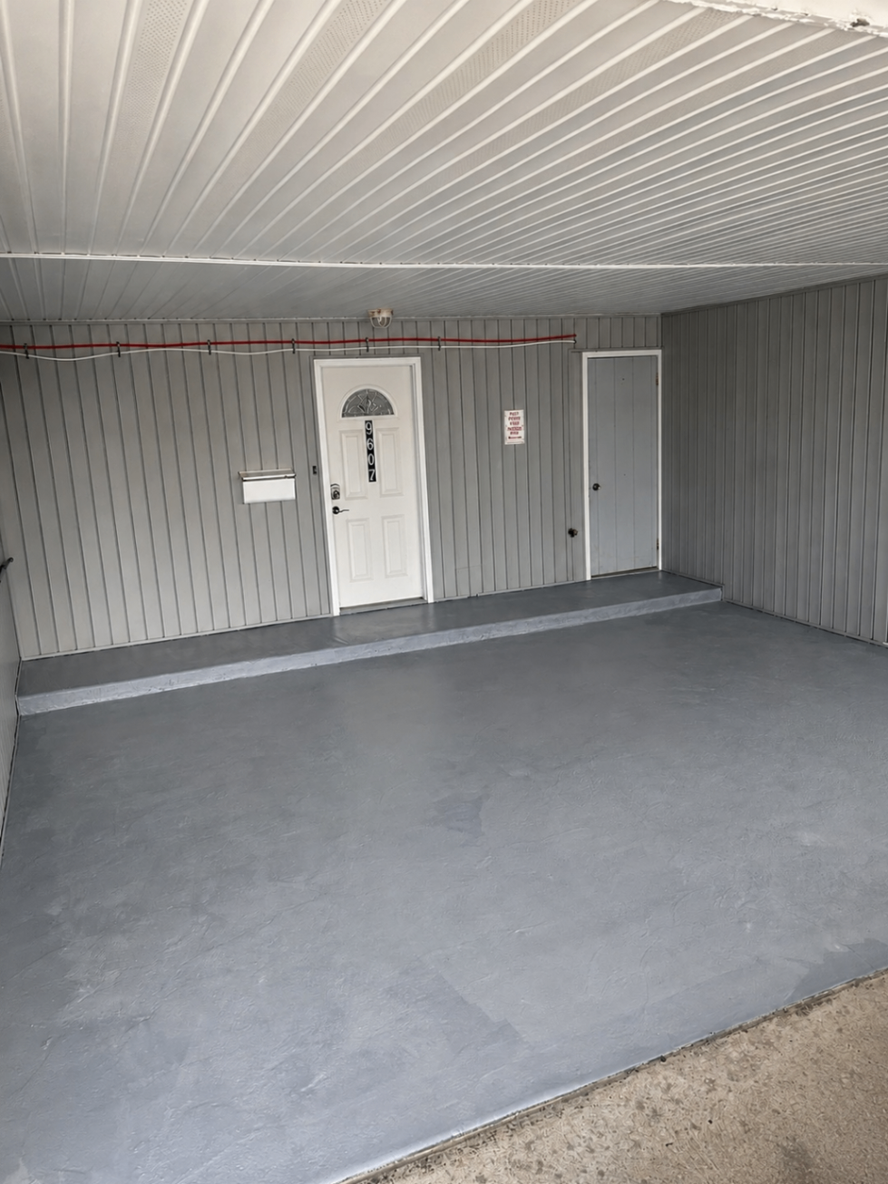 Garage floor resurfaced with fresh gray coating