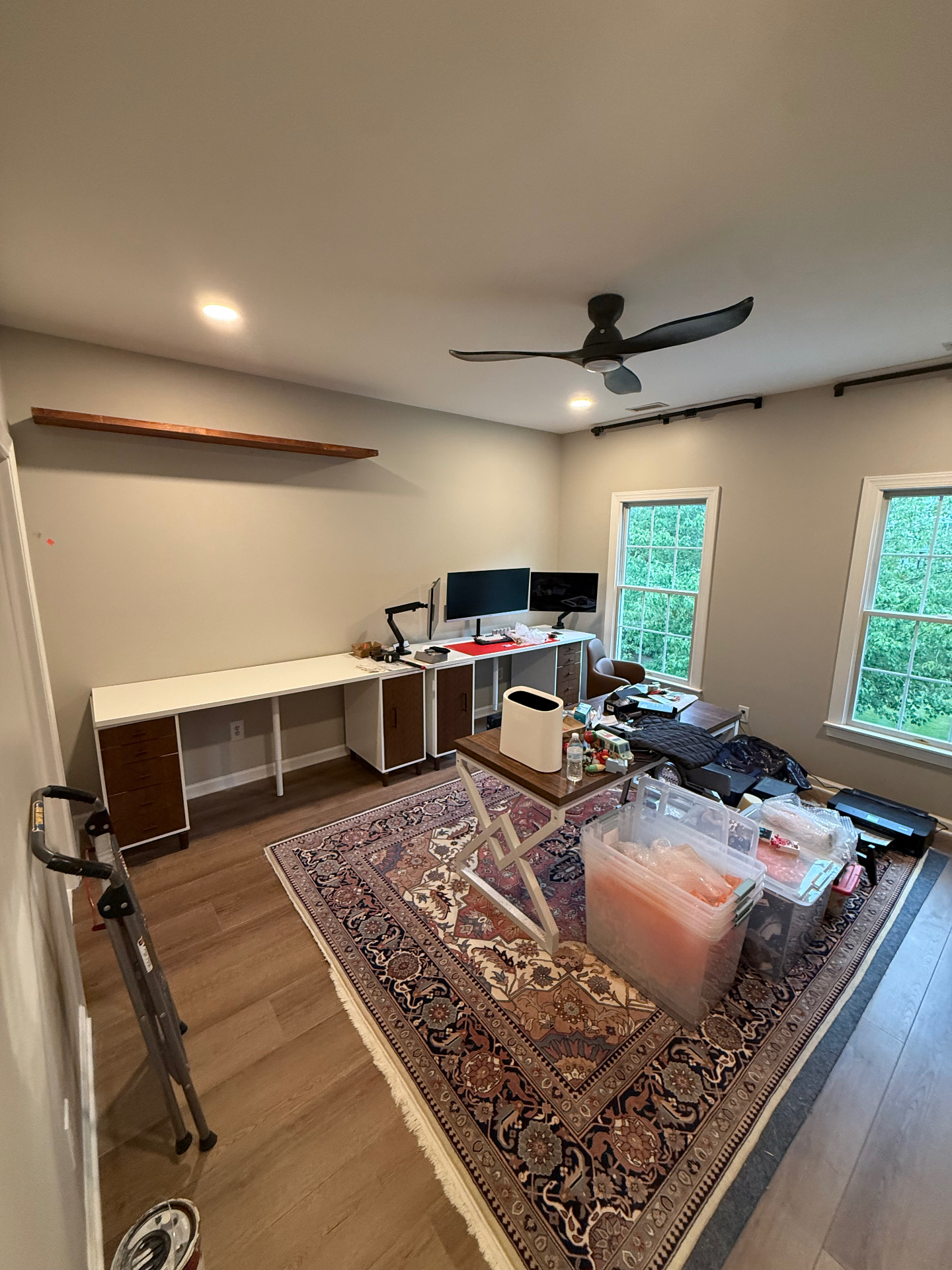Same room converted into a functional home office with built-in desk