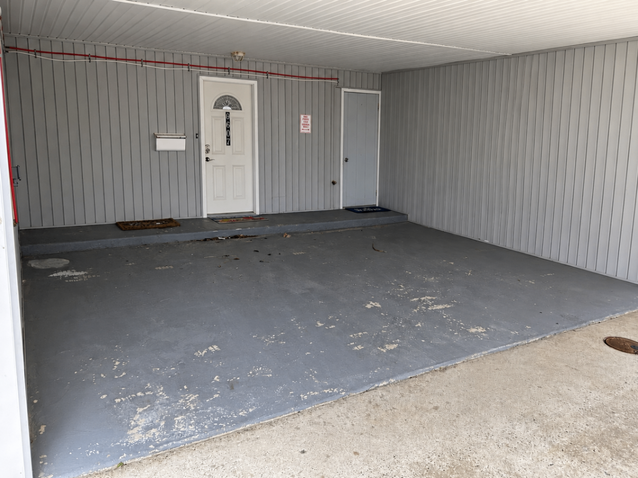Chipped and peeling garage floor before resurfacing